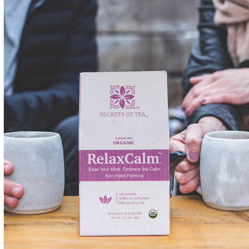RelaxCalm tea package with two people holding mugs.